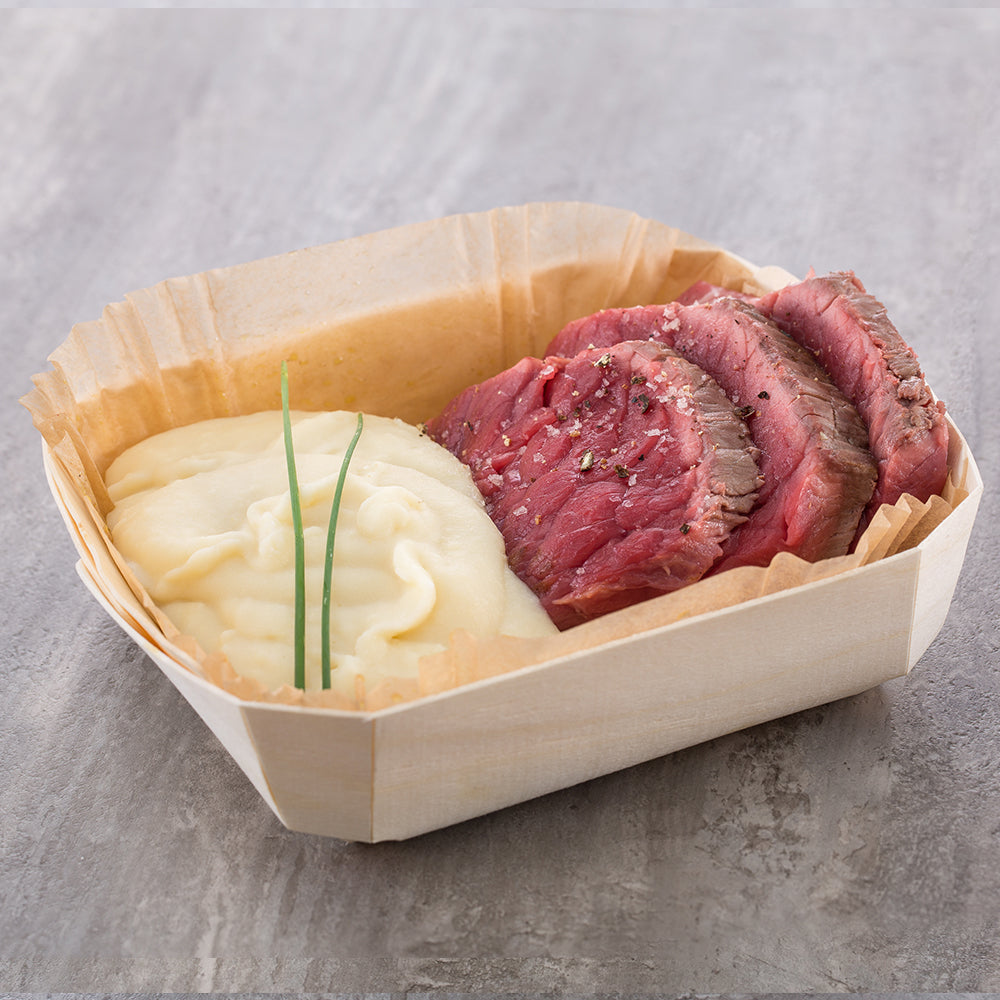 meat and potatoes served in panibois baking molds