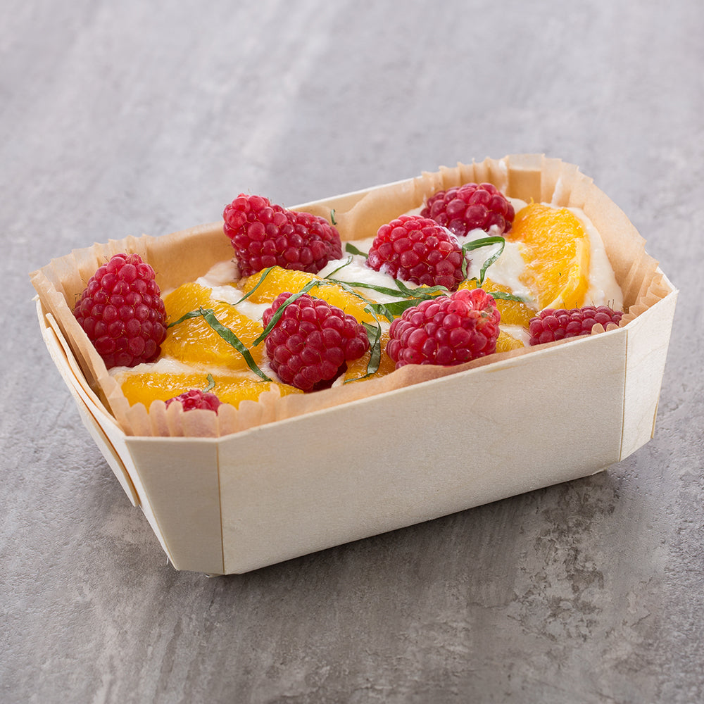 fruit parfait served in wooden pan 